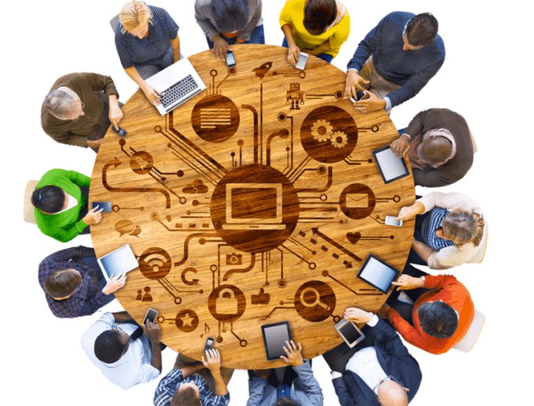 people around a table using their devices