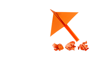 crumbled up ideas and a paper airplane