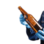 brewery production worker holding bottle