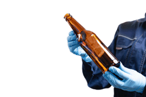 brewery production worker holding bottle